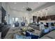 Inviting open-concept living room features comfortable seating and seamless connection to the modern kitchen at 600 Quail Covey Road, Henderson, NV 89002