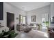 Bright living room with neutral tones, plush seating, and modern decor at 600 Quail Covey Road, Henderson, NV 89002