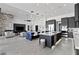 Expansive living space featuring an open kitchen, dining area, and a fireplace at 600 Quail Covey Road, Henderson, NV 89002