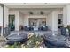 Outdoor patio with a cozy seating area, a fire pit, and water features at 600 Quail Covey Road, Henderson, NV 89002