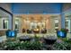 Large covered patio featuring a cozy fire pit, plush seating and decorative water fountains at 600 Quail Covey Road, Henderson, NV 89002