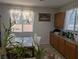 An airy dining area boasts ample natural light and a view of the home's landscaped exterior at 7057 Millers Run St, North Las Vegas, NV 89084