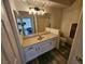 Bright bathroom featuring a single sink vanity and a shower/tub combo at 7115 S Durango Dr # 208, Las Vegas, NV 89113