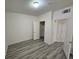 Bright bedroom with ample natural light and modern gray wood-look floors at 7115 S Durango Dr # 208, Las Vegas, NV 89113