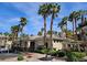 Community clubhouse with manicured landscaping and ample parking at 7115 S Durango Dr # 208, Las Vegas, NV 89113