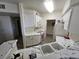 Bright kitchen with white cabinets, marble countertops, and modern appliances at 7115 S Durango Dr # 208, Las Vegas, NV 89113