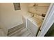 Convenient laundry room equipped with a washer and dryer and storage shelves at 7115 S Durango Dr # 208, Las Vegas, NV 89113