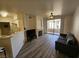 Inviting living room with a fireplace and access to a private balcony at 7115 S Durango Dr # 208, Las Vegas, NV 89113