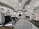 Community lounge with a fireplace, comfortable seating, and a bar area at 7115 S Durango Dr # 208, Las Vegas, NV 89113