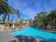 Resort-style pool featuring desert landscaping and comfortable lounge chairs at 7115 S Durango Dr # 208, Las Vegas, NV 89113