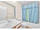 Clean bathroom with a tub and shower combo, vanity sink, and tile flooring at 719 Roberta Alecia Ave, North Las Vegas, NV 89031