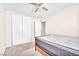 Cozy bedroom with carpeted floors, ceiling fan, and large closet at 719 Roberta Alecia Ave, North Las Vegas, NV 89031