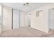 Bright bedroom with closet space, neutral paint, and ceiling fan at 719 Roberta Alecia Ave, North Las Vegas, NV 89031
