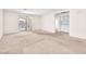 Open concept living room with sliding door to the backyard and access to the laundry room at 719 Roberta Alecia Ave, North Las Vegas, NV 89031