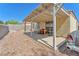 Backyard patio with seating and vintage cars, perfect for outdoor living at 719 Roberta Alecia Ave, North Las Vegas, NV 89031