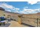 Balcony view of desert landscape and hills, featuring metal railing and patio seating at 722 Chepstow Ave, Las Vegas, NV 89178