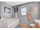 Bathroom featuring a soaking tub with tile flooring and neutral wall decor at 722 Chepstow Ave, Las Vegas, NV 89178