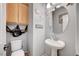 Nautical-themed powder room with pedestal sink and decorative coastal accents at 722 Chepstow Ave, Las Vegas, NV 89178