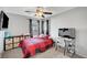Bedroom featuring a ceiling fan, carpet, and two windows at 722 Chepstow Ave, Las Vegas, NV 89178