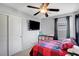 Bedroom with a ceiling fan, TV, and carpeted floor at 722 Chepstow Ave, Las Vegas, NV 89178