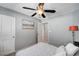 Bright bedroom featuring carpeted flooring, neutral decor, and a ceiling fan at 722 Chepstow Ave, Las Vegas, NV 89178