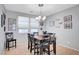 Inviting dining space with chandelier, neutral walls, and charming decor at 722 Chepstow Ave, Las Vegas, NV 89178