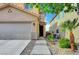 Welcoming home entrance with a step-up walkway, landscaped yard, and an inviting front door at 722 Chepstow Ave, Las Vegas, NV 89178