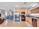 Modern kitchen featuring stainless steel appliances, ample counter space, and an open layout flowing to the living room at 722 Chepstow Ave, Las Vegas, NV 89178