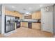 Well-lit kitchen features stainless steel appliances and ample cabinet space at 722 Chepstow Ave, Las Vegas, NV 89178