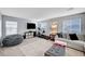 Spacious living room with TV, comfortable seating, and neutral carpet at 722 Chepstow Ave, Las Vegas, NV 89178