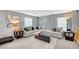 Comfortable living room area with large sectional couch and gray color scheme at 722 Chepstow Ave, Las Vegas, NV 89178
