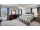 Tranquil main bedroom with balcony access, ceiling fan and neutral tones at 722 Chepstow Ave, Las Vegas, NV 89178