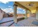 Covered patio with brick flooring and seating area at 722 Chepstow Ave, Las Vegas, NV 89178