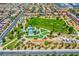 Aerial shot of a park in a housing community with playground, trees, and tennis courts at 7613 Pulpit Rock Ct, Las Vegas, NV 89166