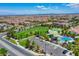 Aerial view of a community park featuring a splash pad, playground, and green space at 7613 Pulpit Rock Ct, Las Vegas, NV 89166