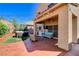 Outdoor space with a covered patio, hot tub, and an outdoor kitchen perfect for entertaining at 7613 Pulpit Rock Ct, Las Vegas, NV 89166