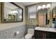 Stylish half-bathroom with decorative tile and modern fixtures at 7613 Pulpit Rock Ct, Las Vegas, NV 89166