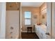 Bright bathroom featuring a shower over tub combo, stylish vanity with sink, and wood-look flooring at 7613 Pulpit Rock Ct, Las Vegas, NV 89166