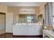 Well-lit bathroom with a double vanity, ample storage, and wood flooring at 7613 Pulpit Rock Ct, Las Vegas, NV 89166