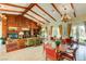 Well-lit clubhouse with wooden beams, charming decor, tables, and a cozy fireplace at 7613 Pulpit Rock Ct, Las Vegas, NV 89166