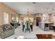 Open floor plan featuring dining room with view into kitchen and outdoor space at 7613 Pulpit Rock Ct, Las Vegas, NV 89166