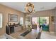Cozy dining area features stylish decor, modern light fixture, and backyard access at 7613 Pulpit Rock Ct, Las Vegas, NV 89166