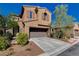 Beautiful two-story home with a two-car garage, desert landscaping, and a well-maintained front yard at 7613 Pulpit Rock Ct, Las Vegas, NV 89166