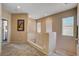 Upstairs hallway with white banister, neutral paint, and plenty of natural light at 7613 Pulpit Rock Ct, Las Vegas, NV 89166