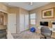 Comfortable home office with a modern desk setup, closet and plenty of natural light at 7613 Pulpit Rock Ct, Las Vegas, NV 89166