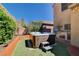 Exterior image showcasing a hot tub nestled in the backyard with a built-in grill at 7613 Pulpit Rock Ct, Las Vegas, NV 89166