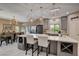Open kitchen and dining area with stainless steel appliances and an island with a cooktop at 7613 Pulpit Rock Ct, Las Vegas, NV 89166