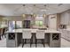 Modern kitchen featuring a large island with seating and ample cabinet space at 7613 Pulpit Rock Ct, Las Vegas, NV 89166