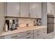 Kitchen countertop space with cabinets and built in oven appliance at 7613 Pulpit Rock Ct, Las Vegas, NV 89166
