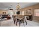 Open floor plan featuring living room and dining area with backyard views at 7613 Pulpit Rock Ct, Las Vegas, NV 89166